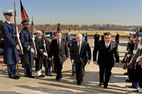 Defense Secretary Robert M. Gates, center, escorts Afghan Interior Minister Bismullah Mohammadi, left, and Defense Minister Abdul Rahim Wardak, right, into the Pentagon for a security consultation forum, Feb. 23, 2011